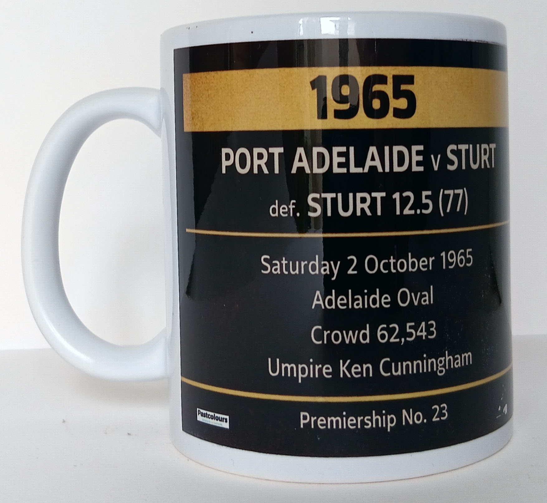 Port Adelaide 1965 Premiers Mug rear panel showing SANFL Grand Final score Port Adelaide 12.8 (80) defeated Sturt 12.5 (77) at Adelaide Oval before 62,543 spectators